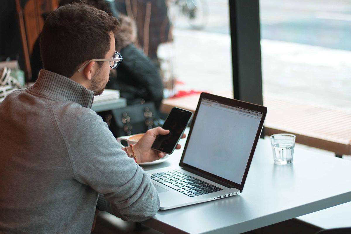 man in cafe on his laptop